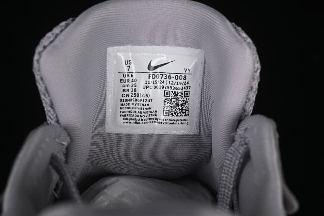 Tongue label showing style code FD0736-008 and sample size markings
