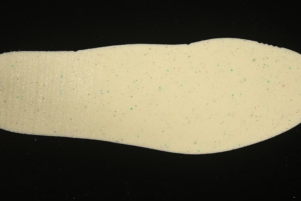 Light-colored shoe insole shown separately