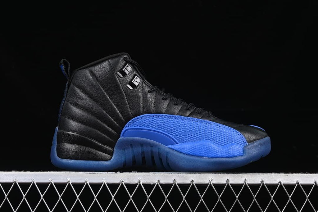 Side profile of a black and blue Air Jordan 12 sneaker
