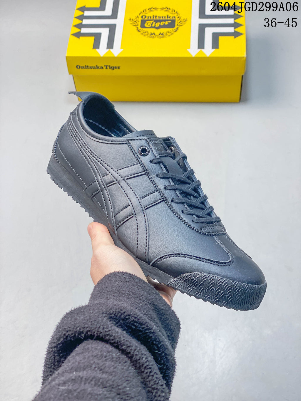 Angled side view of a charcoal gray sneaker with stitched panels and textured toe outsole