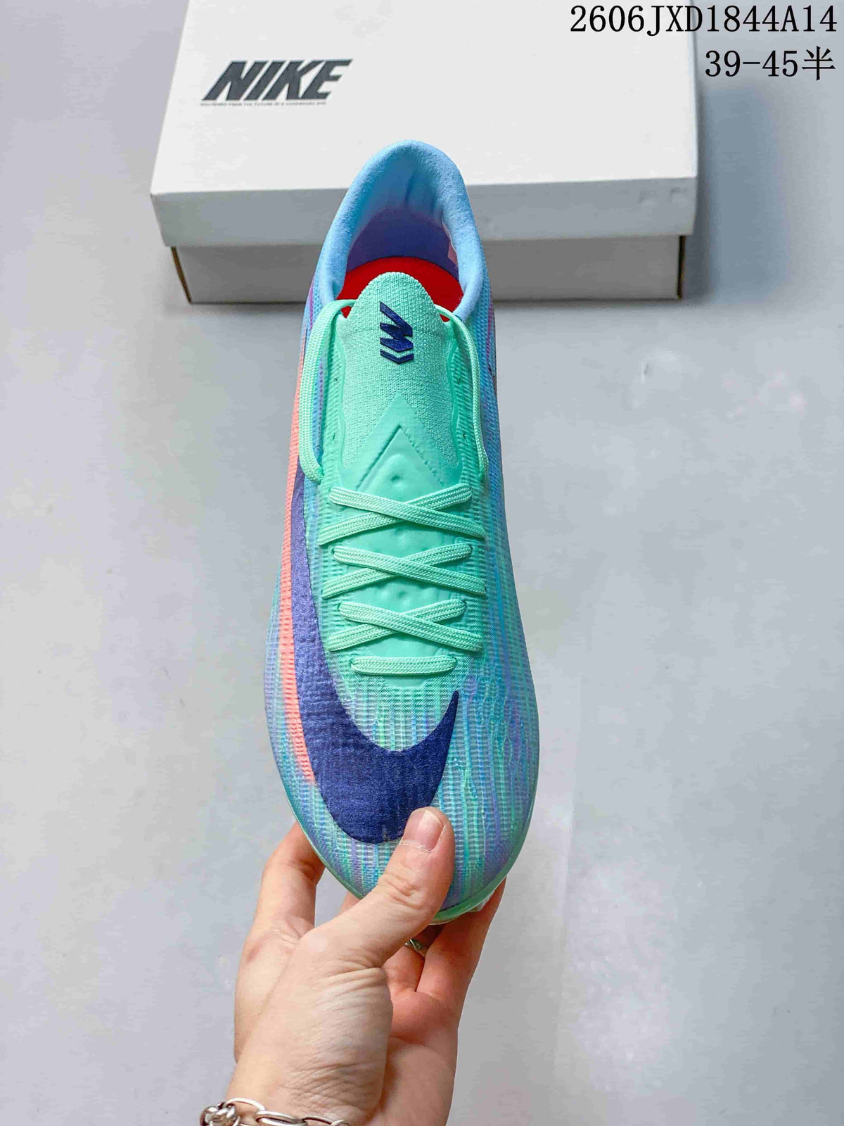 Top view of the cleat showing its laces, mint tongue, and large blue toe mark.
