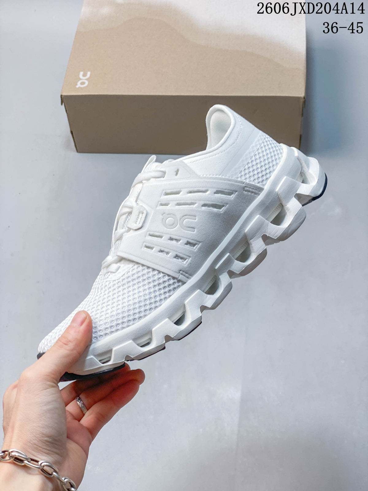 Side view of a white running shoe showing its mesh-patterned upper and structured panel