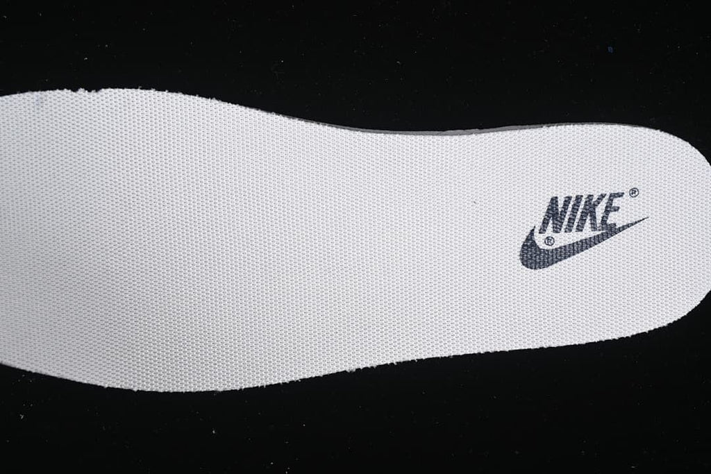 Close-up of a white insole with a Nike logo