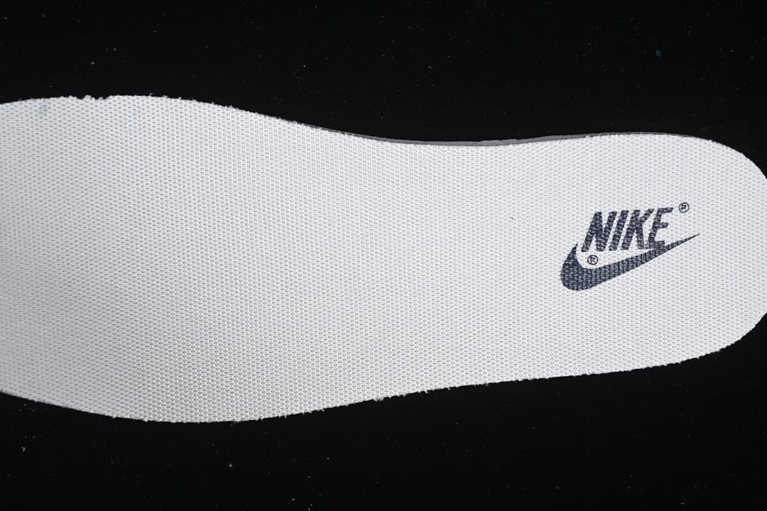 Close-up of a white insole with a Nike logo