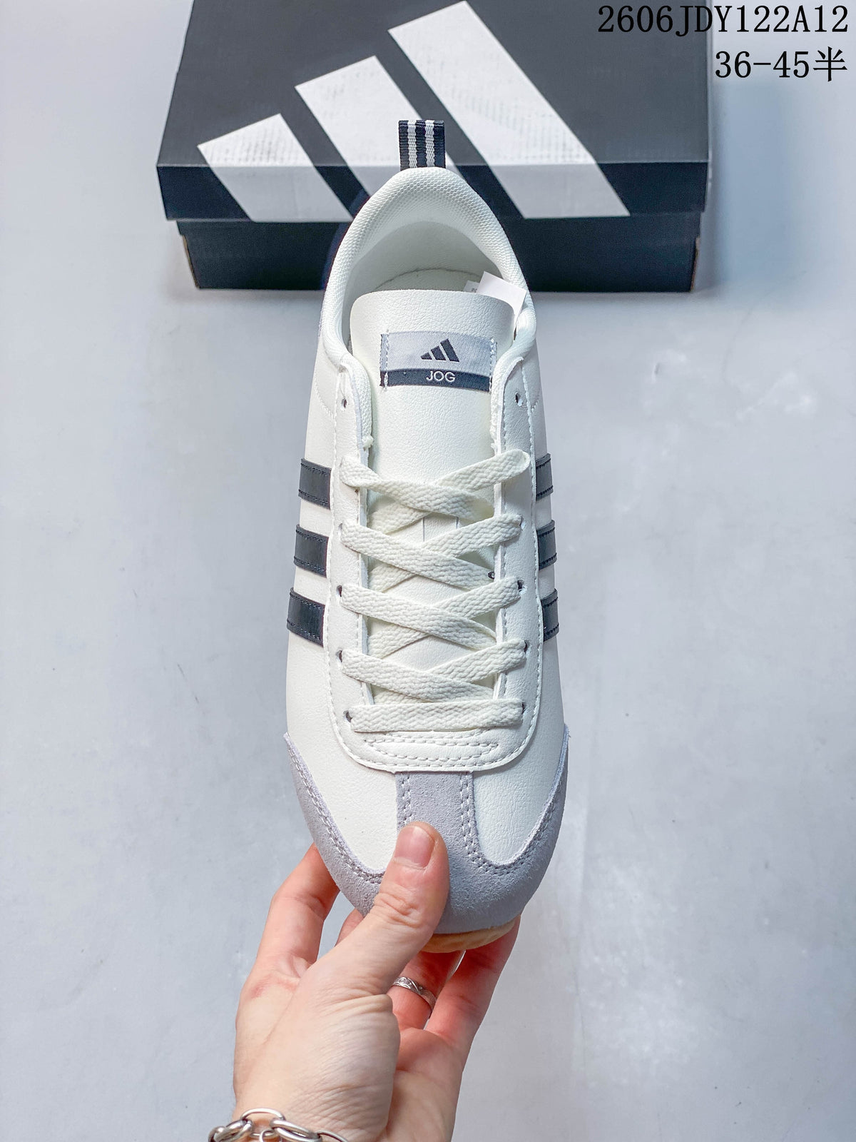 Top view of the lace-up sneaker with dark stripes and gray toe overlay.