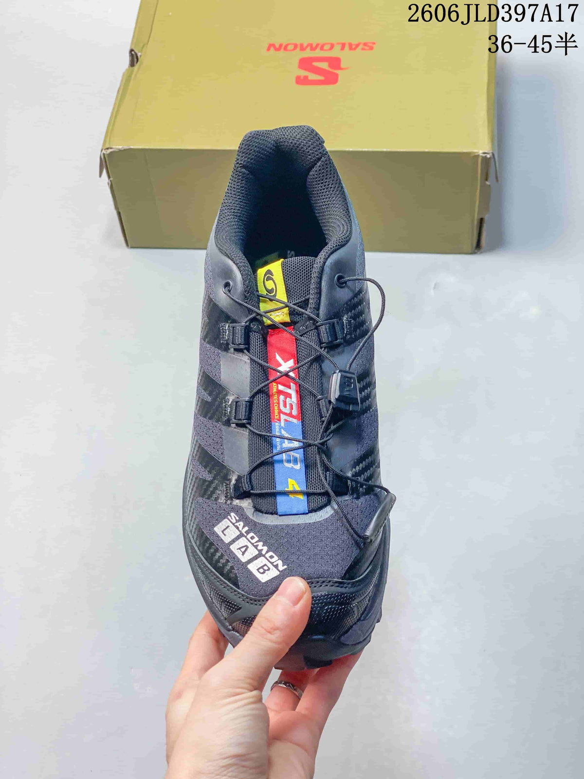 Front view of a Salomon XT-4 OG sneaker with multicolor tongue detailing