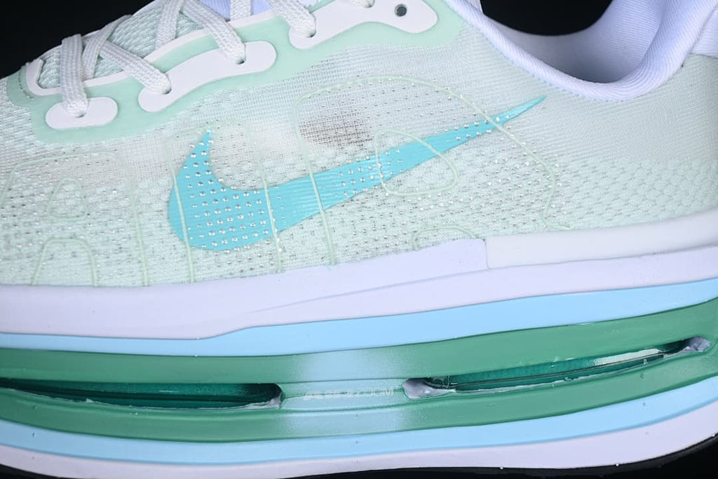 Close-up of the lateral upper, light blue swoosh and visible midsole cushioning