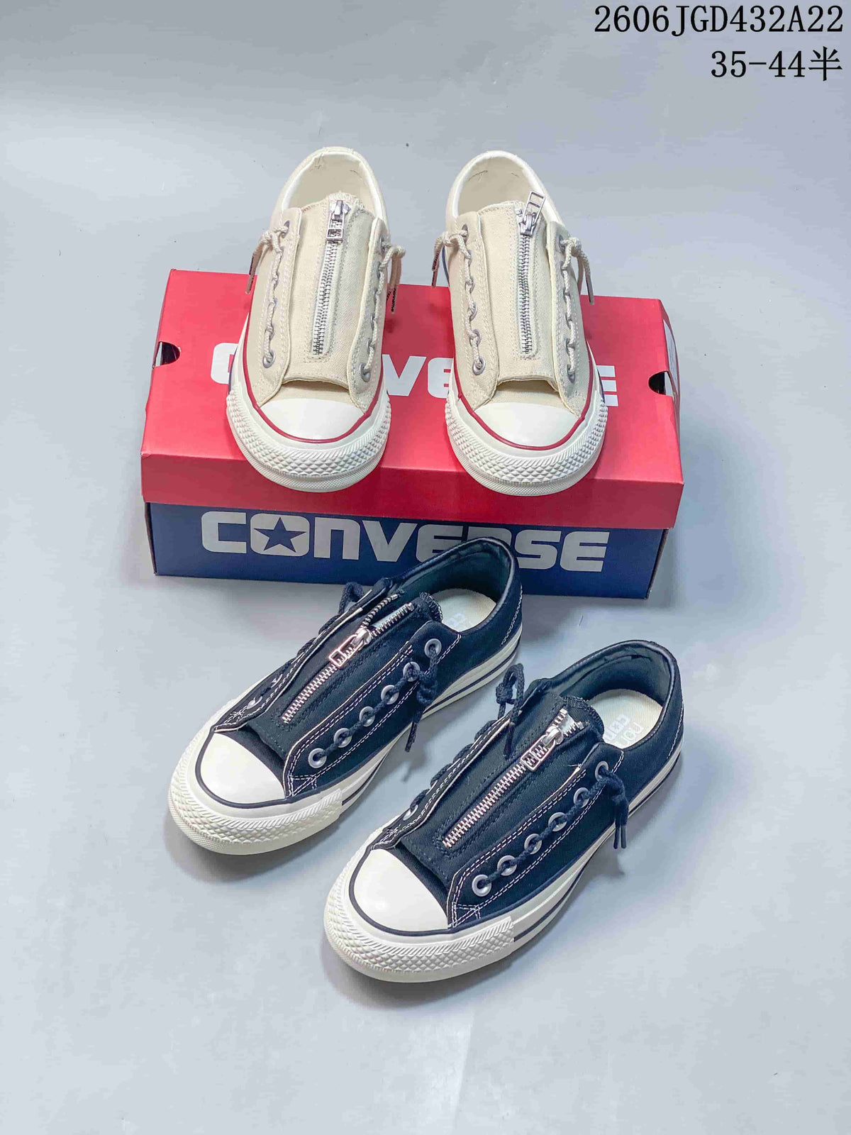 Black and light beige low-top Converse sneakers shown together