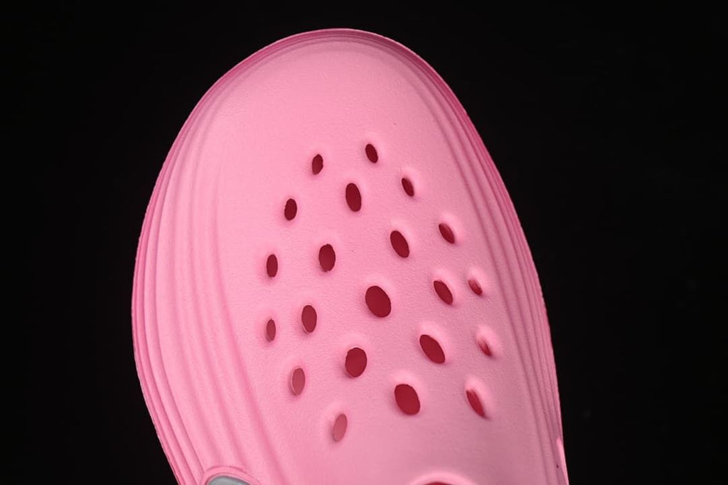 Top view of the pink clog highlighting the perforated toe area.
