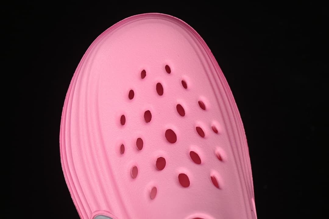 Top view of the pink clog highlighting the perforated toe area.