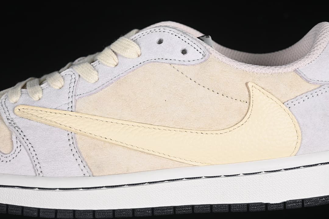 Close-up of the cream Swoosh and layered upper panels