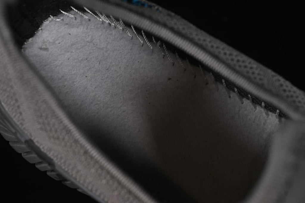 Interior view showing the shoe's lining and stitching