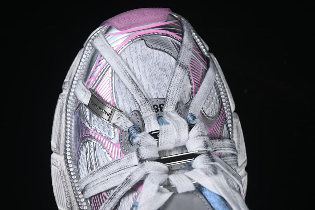 Top-down close-up of the sneaker’s laces and layered upper