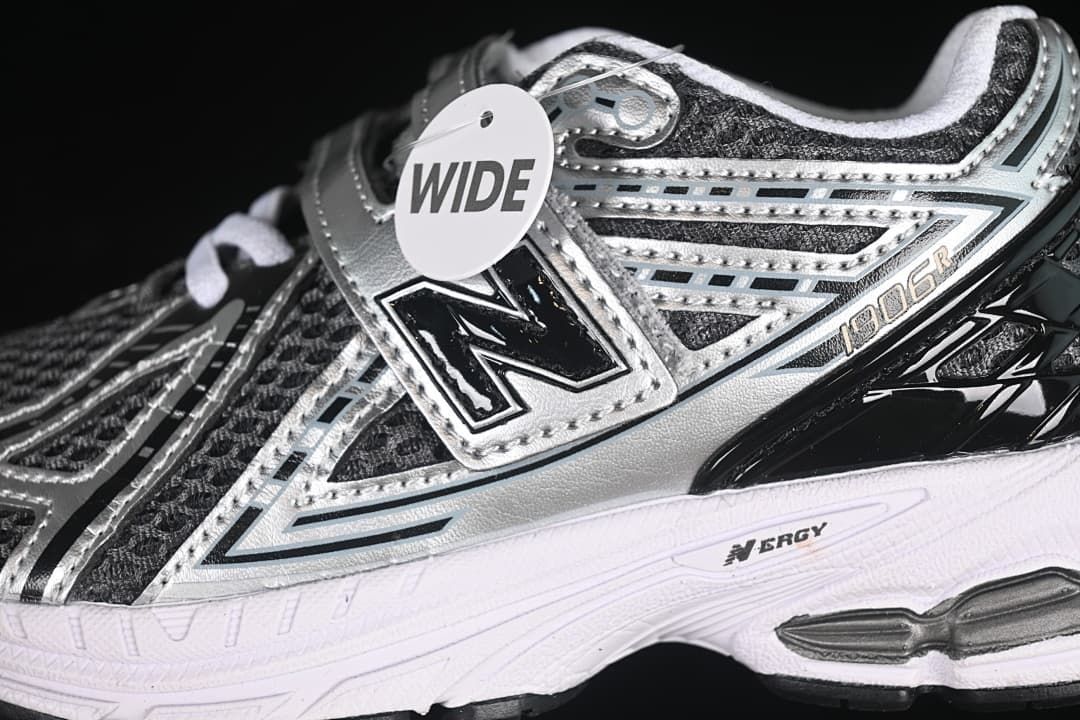 Close-up of the silver side overlays, hook-and-loop strap, and wide tag