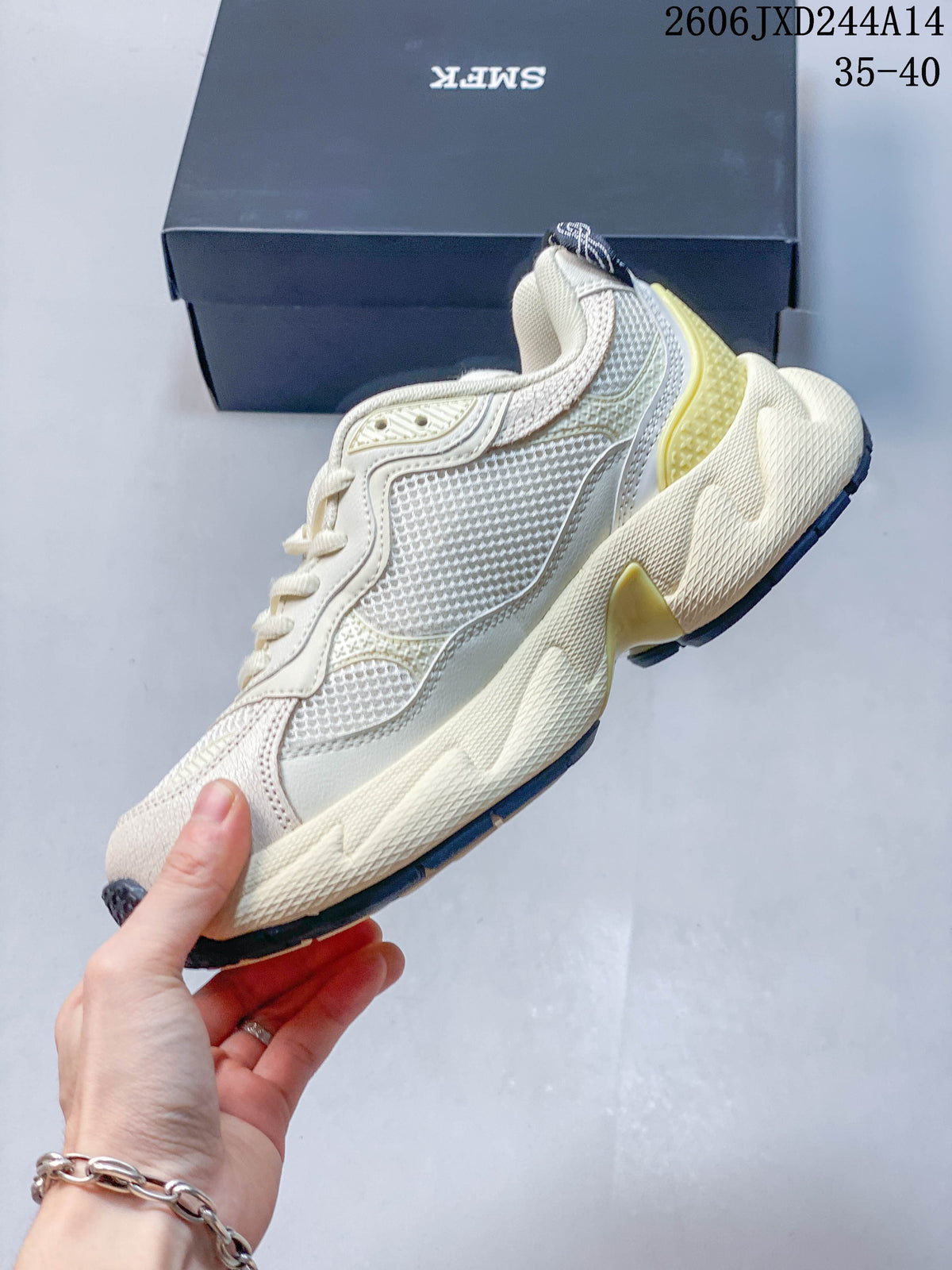 Side view of the low-top sneaker, showing layered panels, mesh sections, and a sculpted sole.