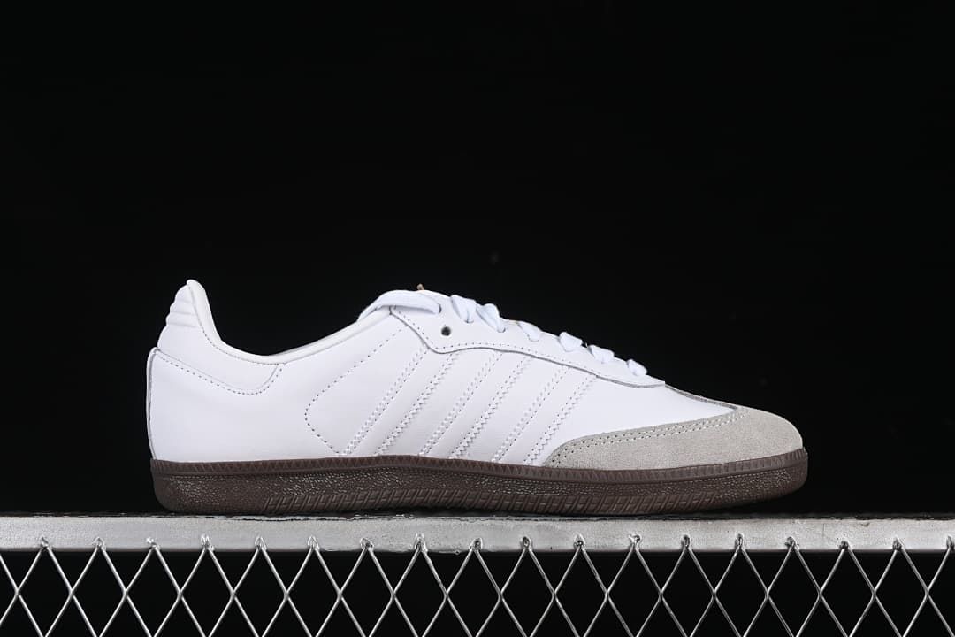 Side profile showing the white upper, light gray toe panel, and gum sole