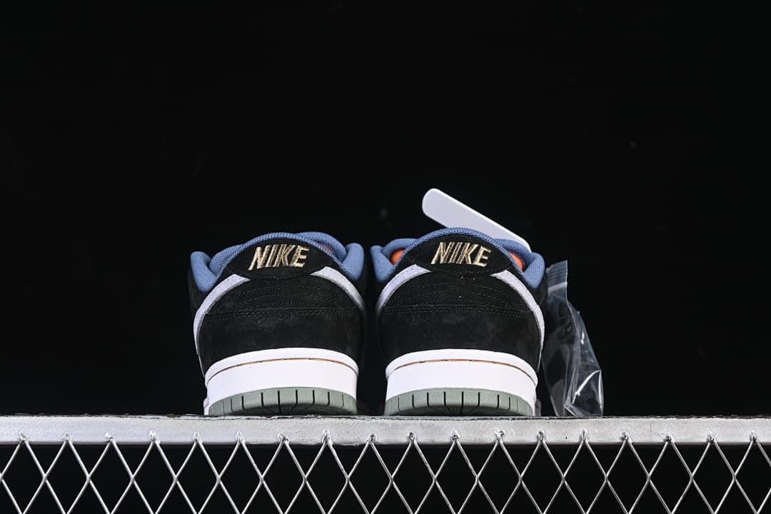 Rear view of both shoes with black heel panels and blue collar accents