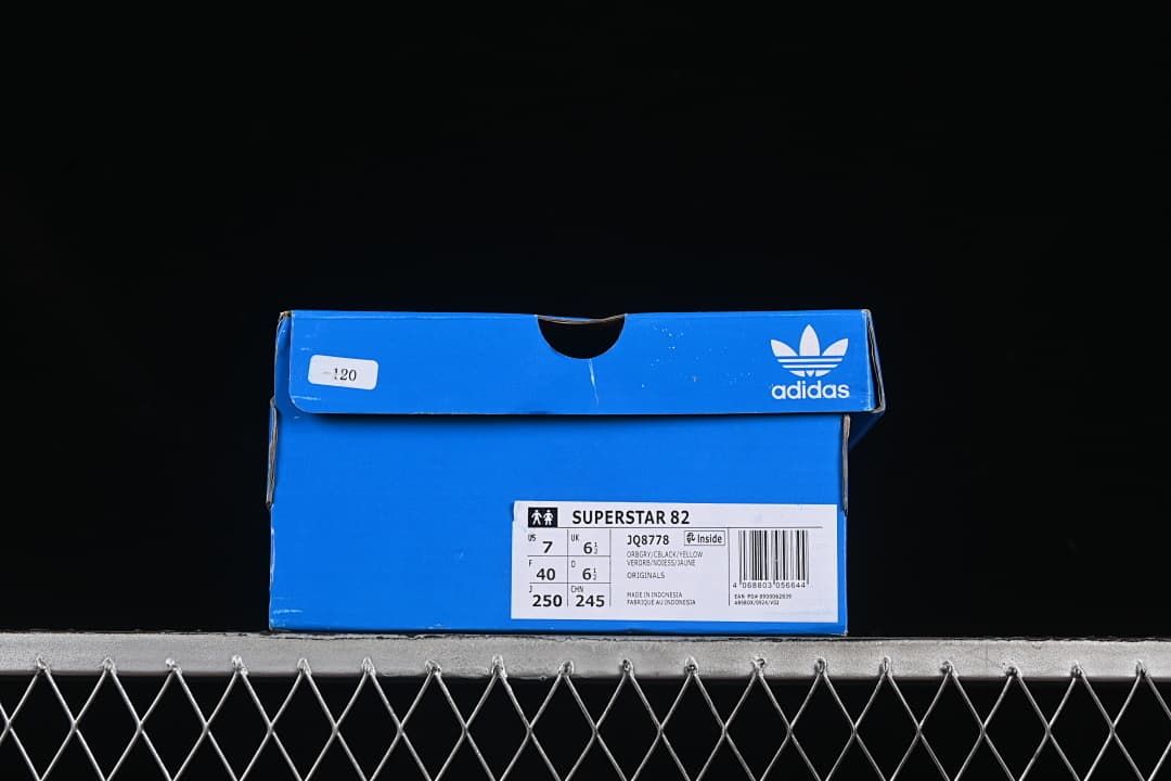 Blue adidas shoe box with Superstar 82 JQ8778 label