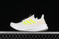 Side view of a white adidas Ultraboost 5 with bright lime accents