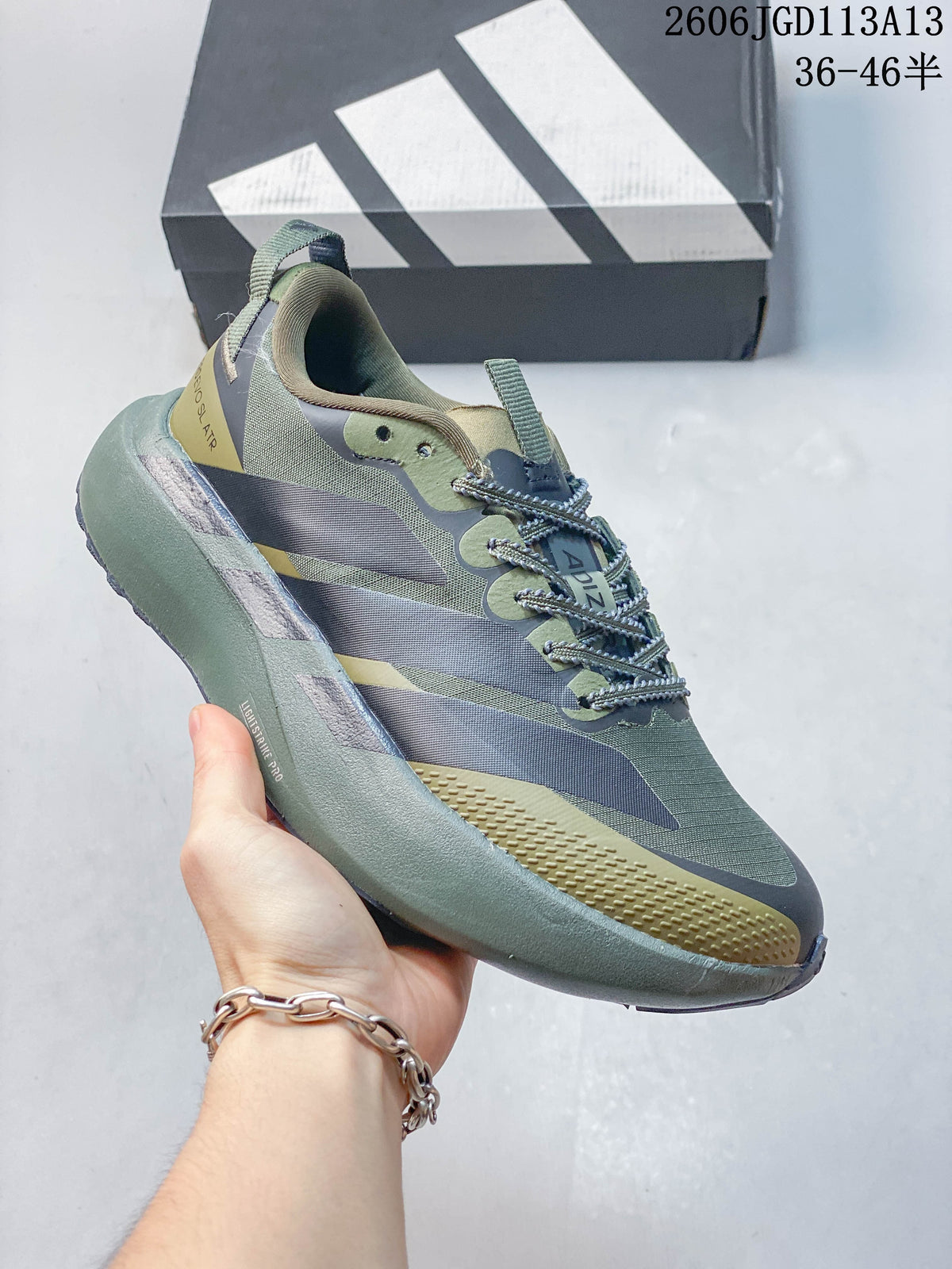 Side view of an olive running shoe with three-stripe detailing