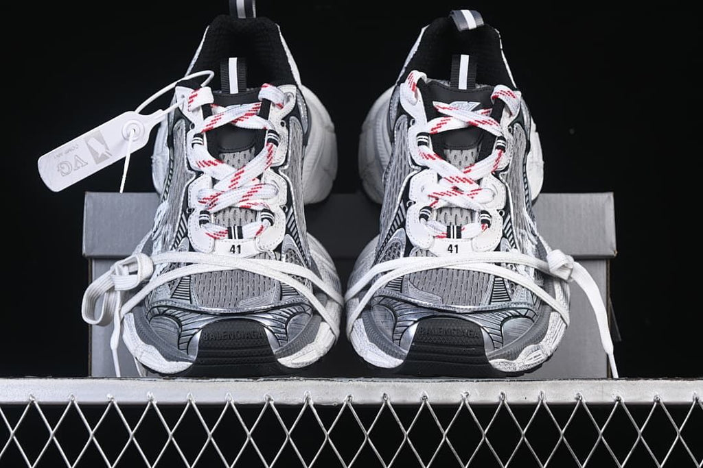 Front view of the pair with patterned laces and layered detailing