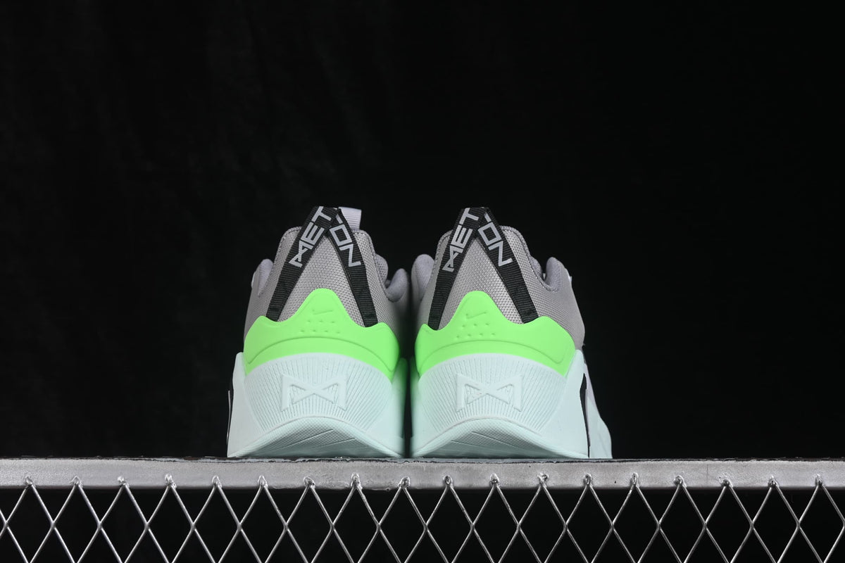 Rear view of the pair showing bright green heel panels, gray uppers, and black-and-white heel branding.