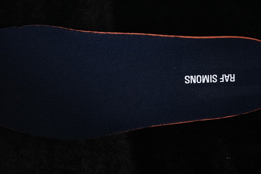 Dark insole with Raf Simons lettering