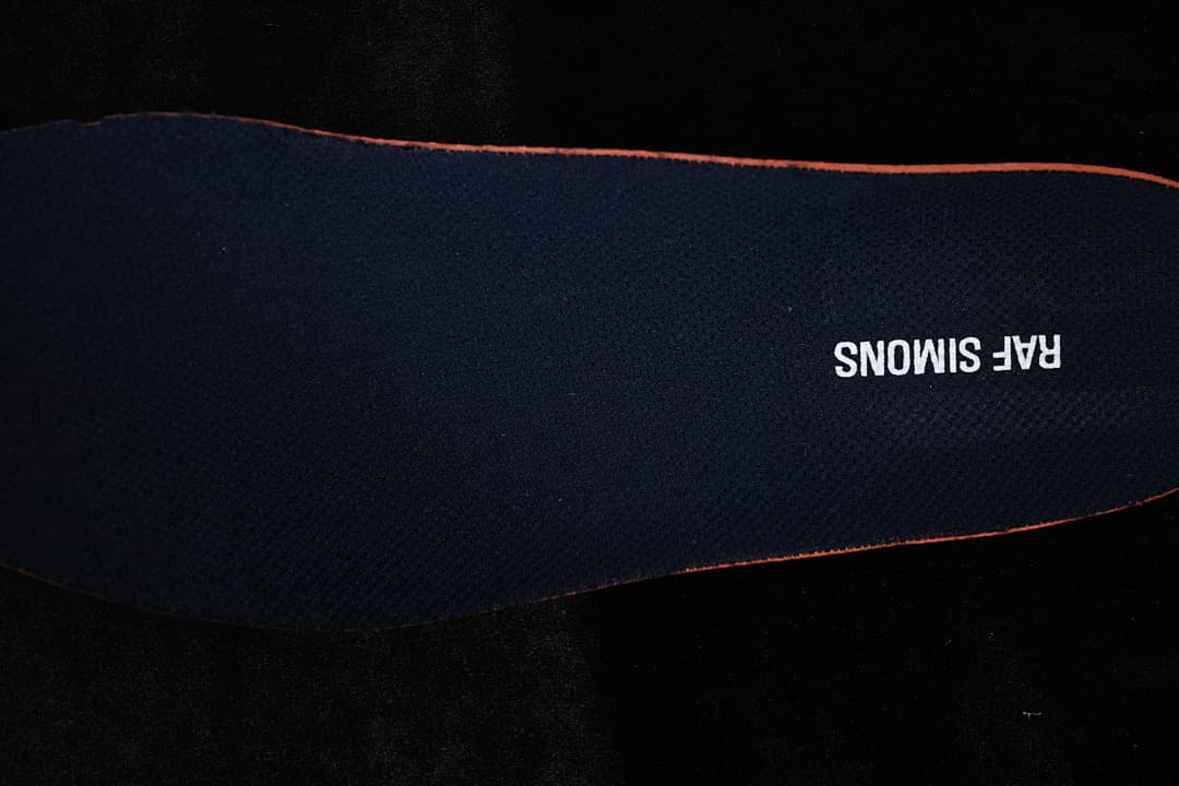 Dark insole with Raf Simons lettering