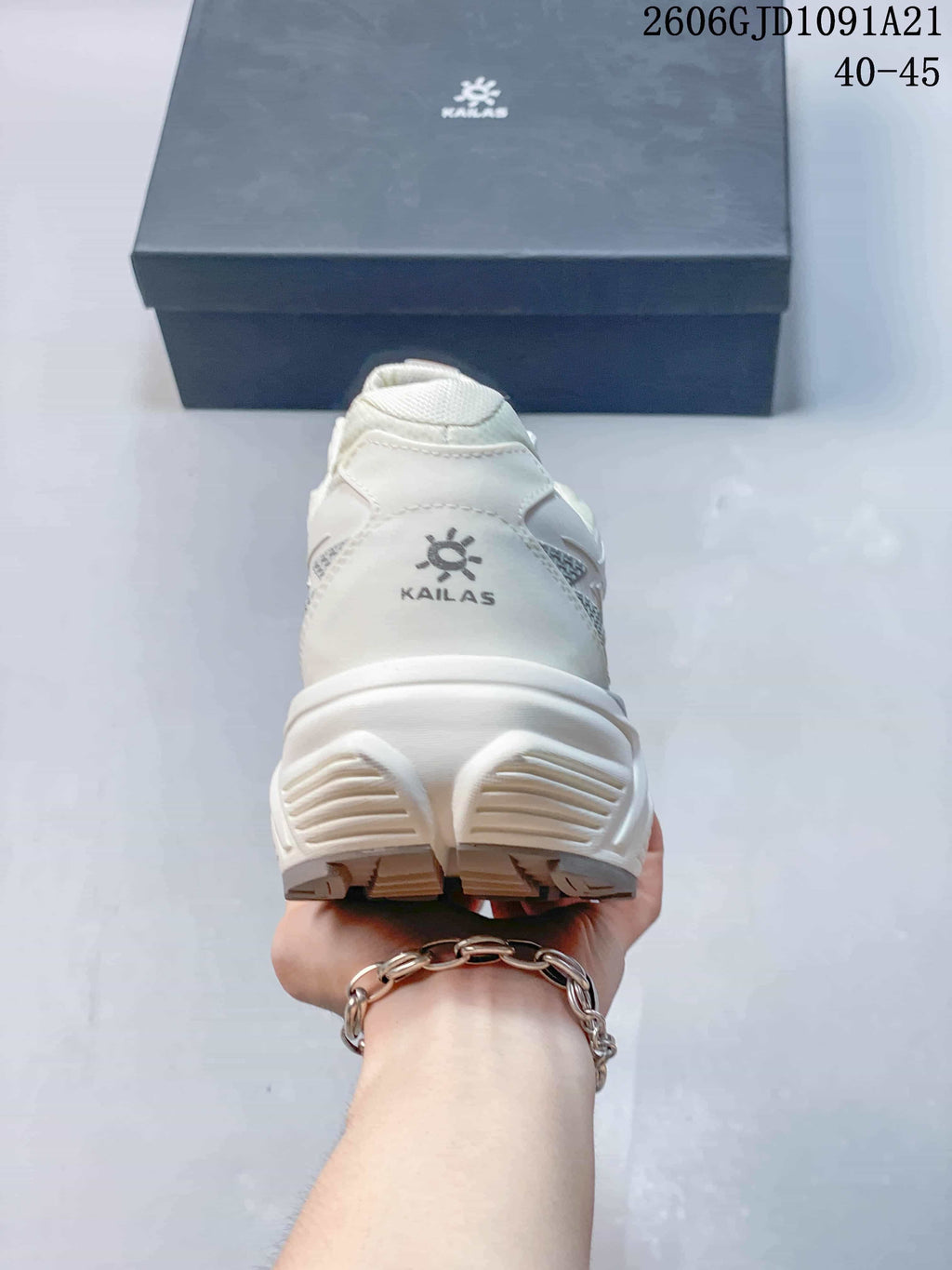 Rear view showing the heel and outsole of a white Kailas trail shoe