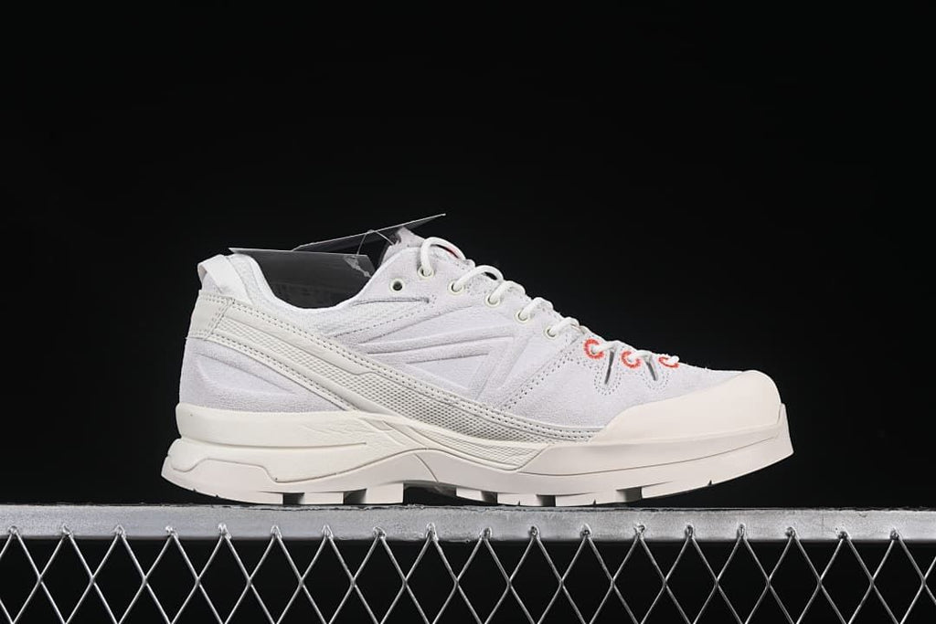 Side profile highlighting the layered midsole and reinforced toe