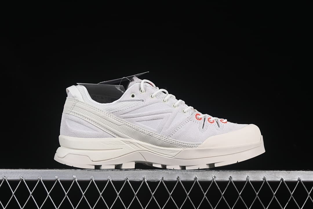 Side profile highlighting the layered midsole and reinforced toe
