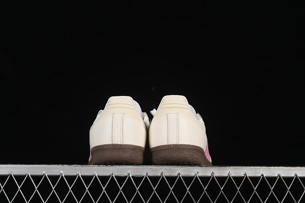 Rear view of both sneakers and their gum-colored outsoles