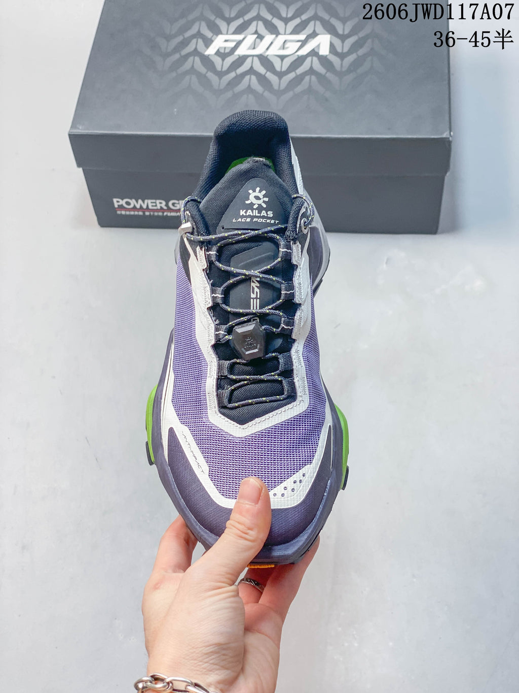 Top view highlighting the shoe's quick-lacing system and purple upper.