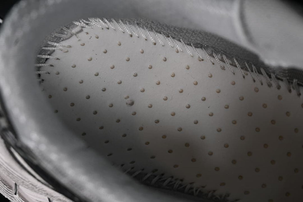 Interior view showing perforated lining and stitched construction