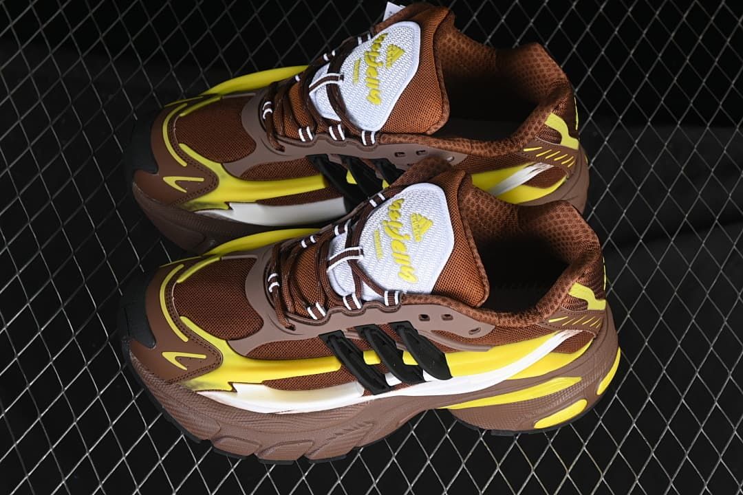Pair of brown, yellow, and white Adistar Jellyfish sneakers viewed from above
