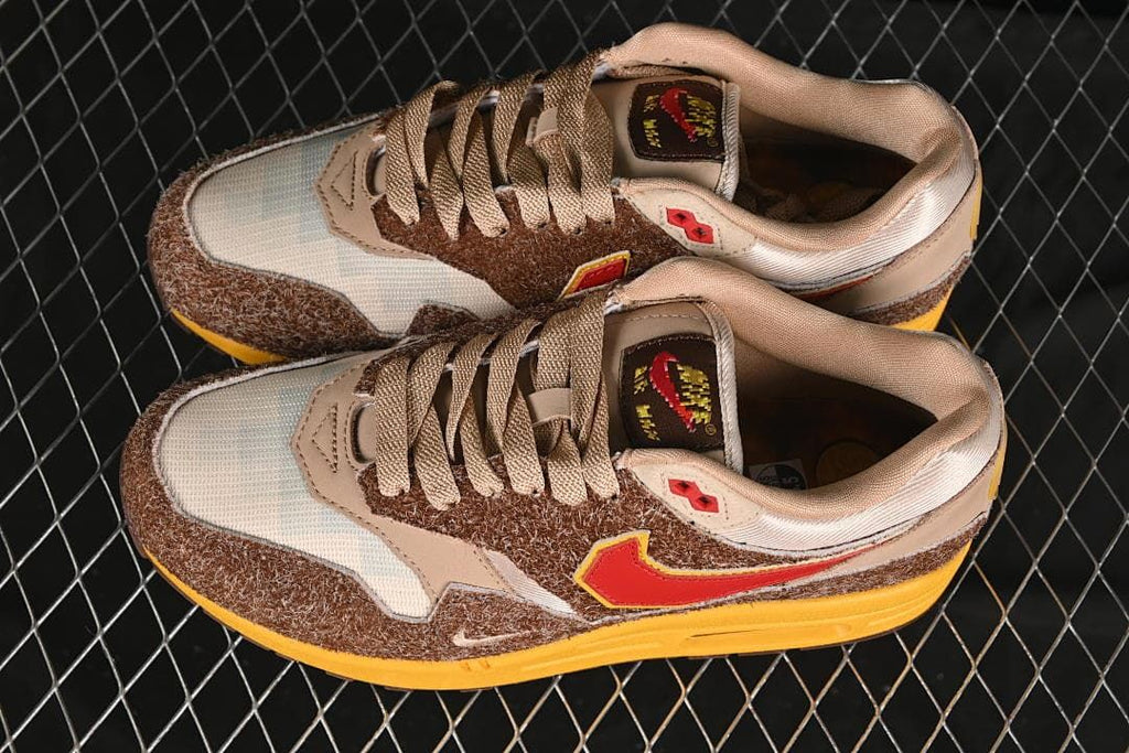 Pair of Nike Air Max 1 Big Head Origins sneakers viewed from above at an angle.