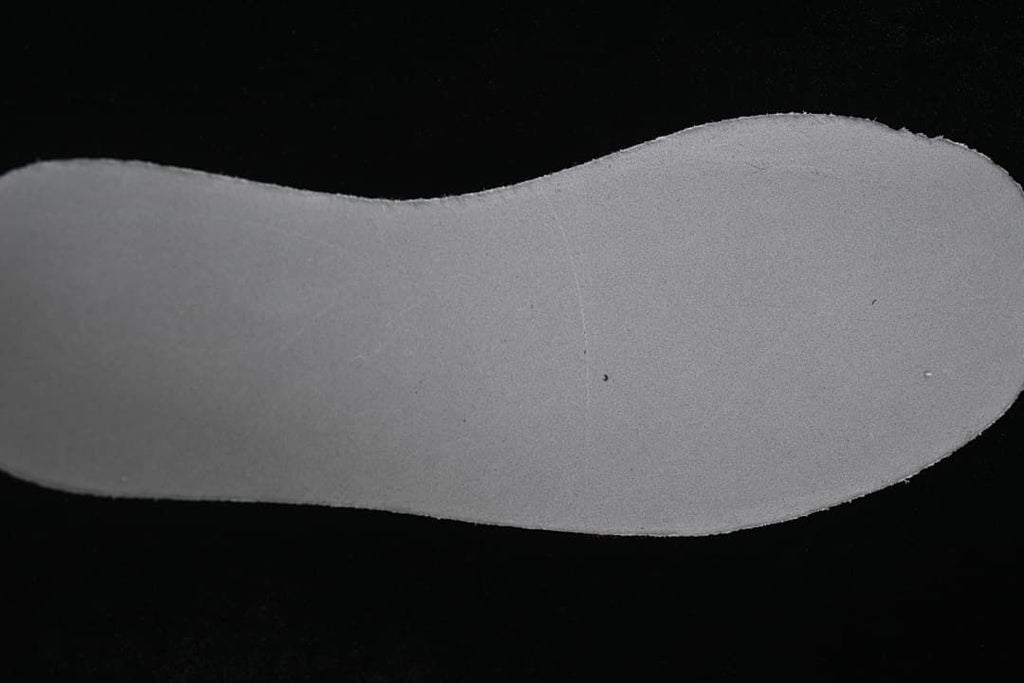 Close-up view of the light-colored shoe insole