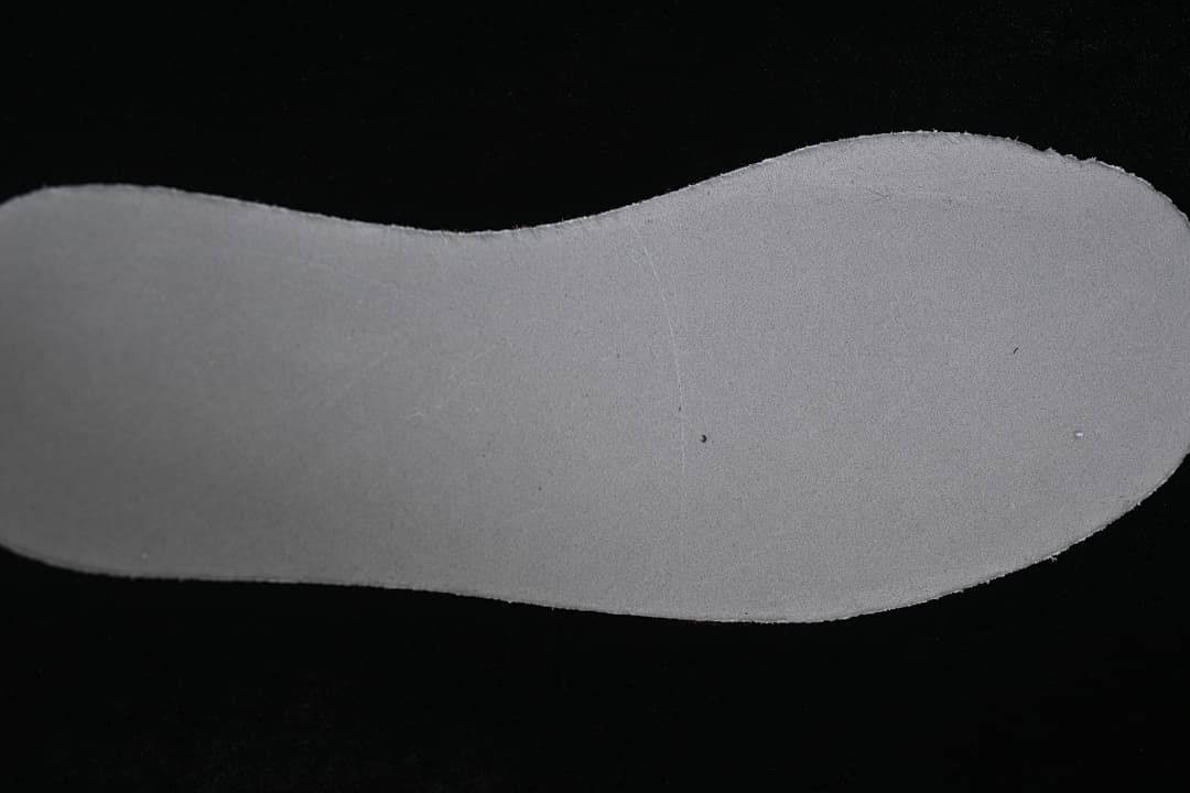 Close-up view of the light-colored shoe insole