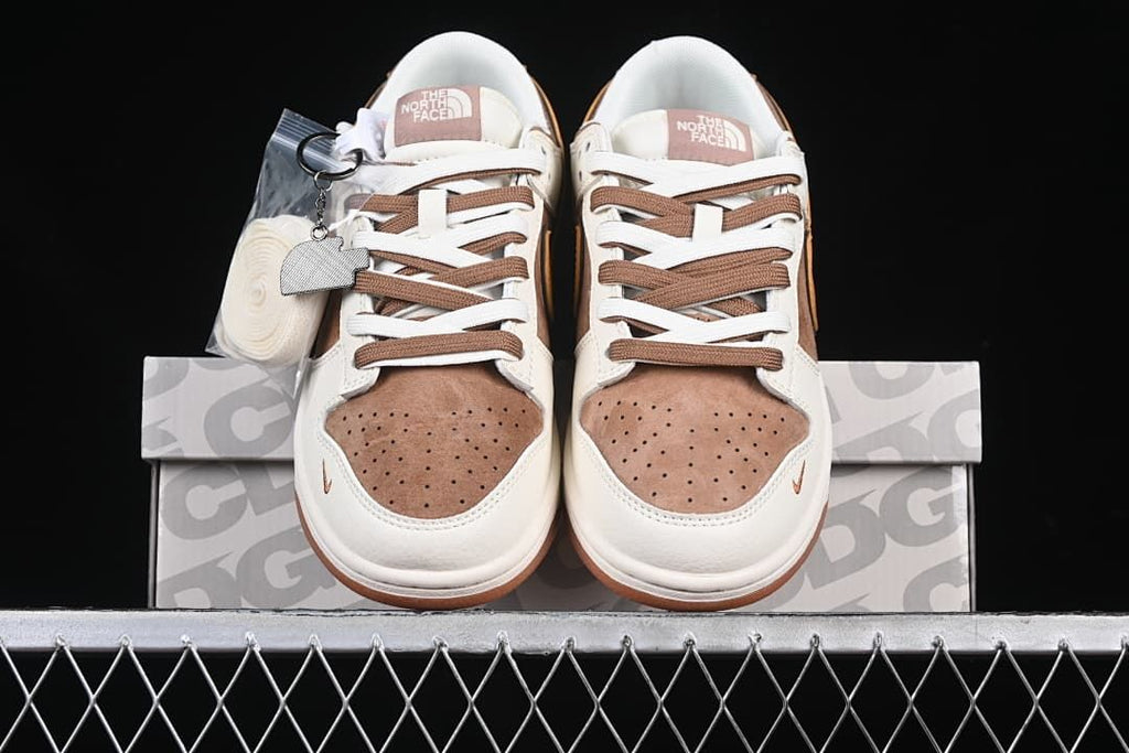 Front view of the pair with perforated brown toe boxes and contrasting laces