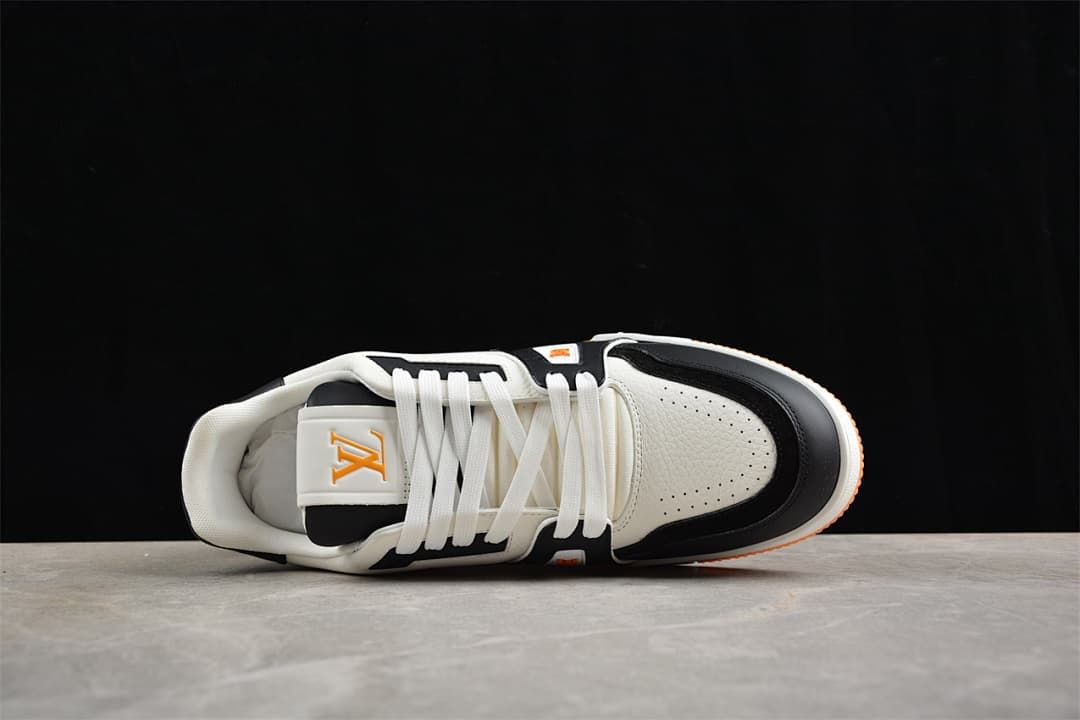 Top view of the sneaker showing its laces, tongue, and perforated toe