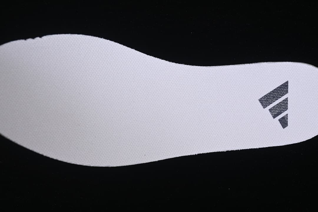 Close-up of the insole showing an adidas mark.
