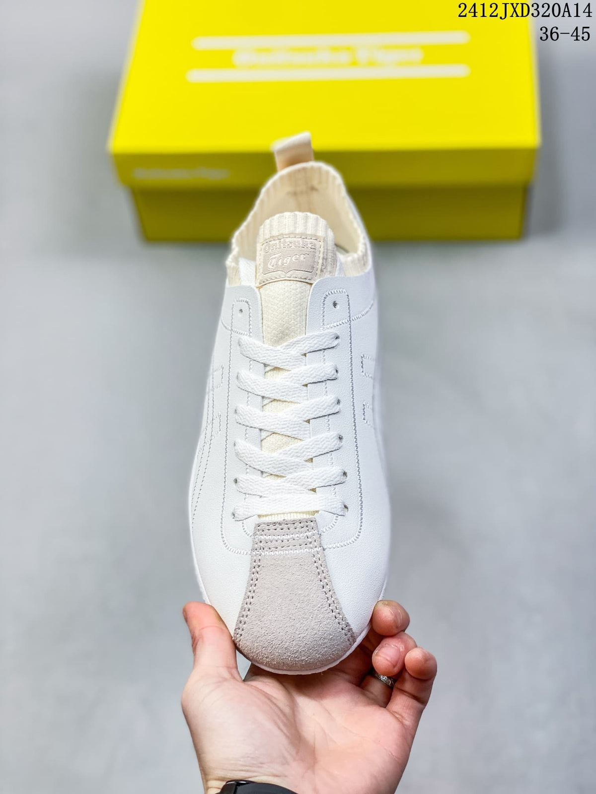 Front view of the sneaker with white laces and a gray toe overlay