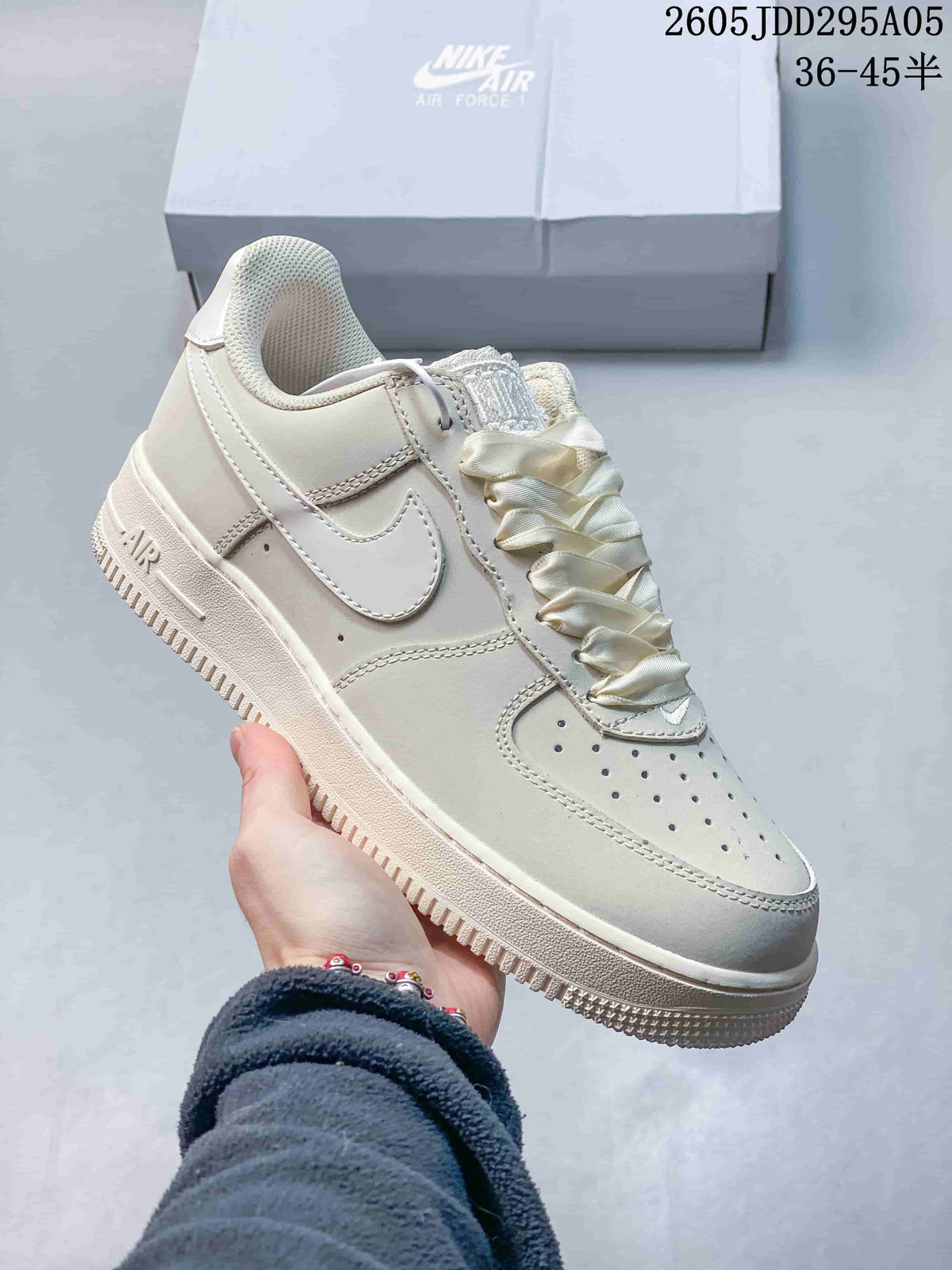 Cream Nike Air Force 1 low-top sneaker with tonal Swoosh and satin-style laces
