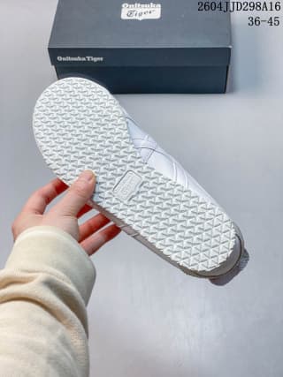 Underside view showing the repeating textured tread pattern on the sneaker outsole.