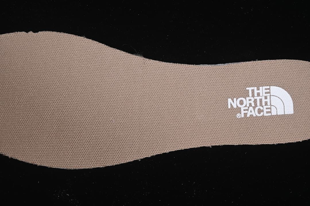 Close-up of a brown insole with The North Face logo