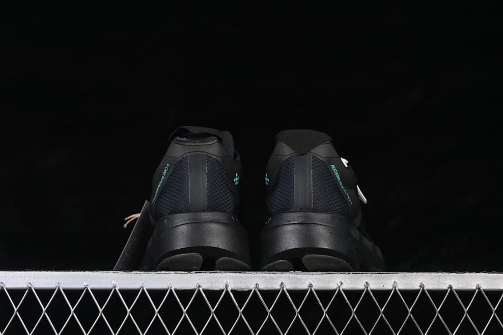 Rear view of the pair of black running shoes