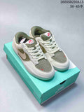 Pair of Nike SB Force 58 low-top shoes in olive, white, and pale pink, shown from above.