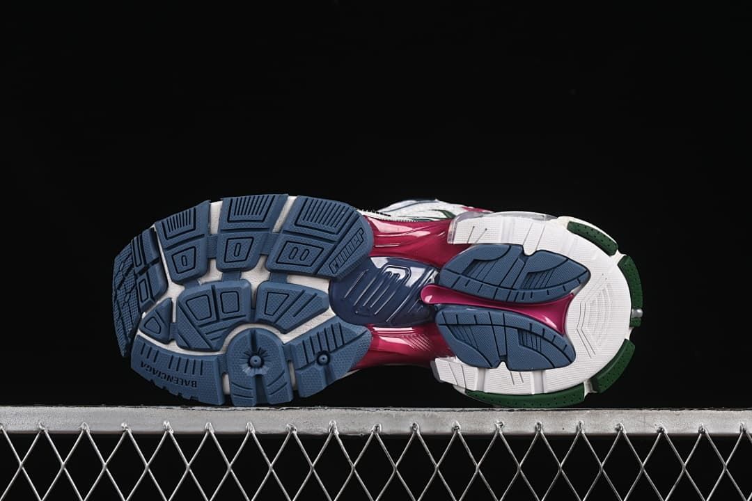 Underside view showing the segmented blue, white, and green outsole