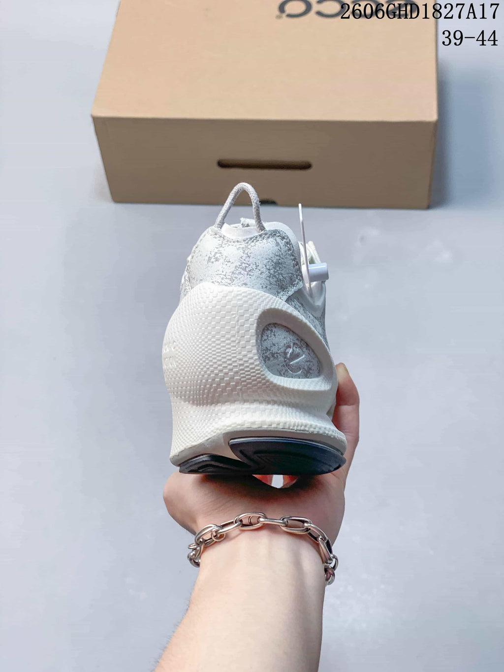 Rear view of the patterned sneaker showing its sculpted heel and outsole.