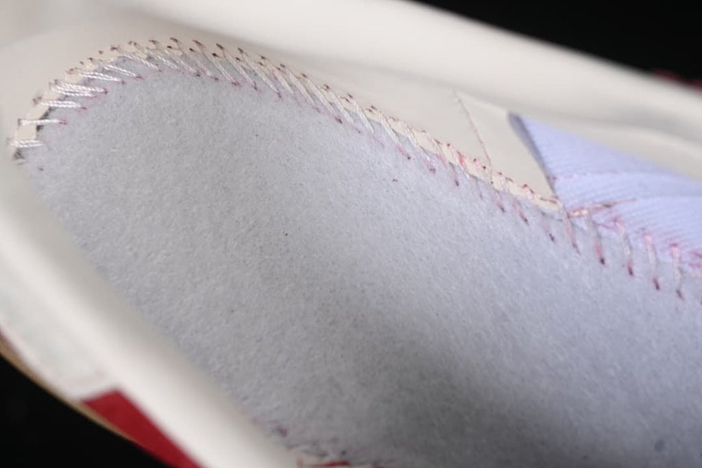 Close-up of the sneaker's light-colored interior stitching